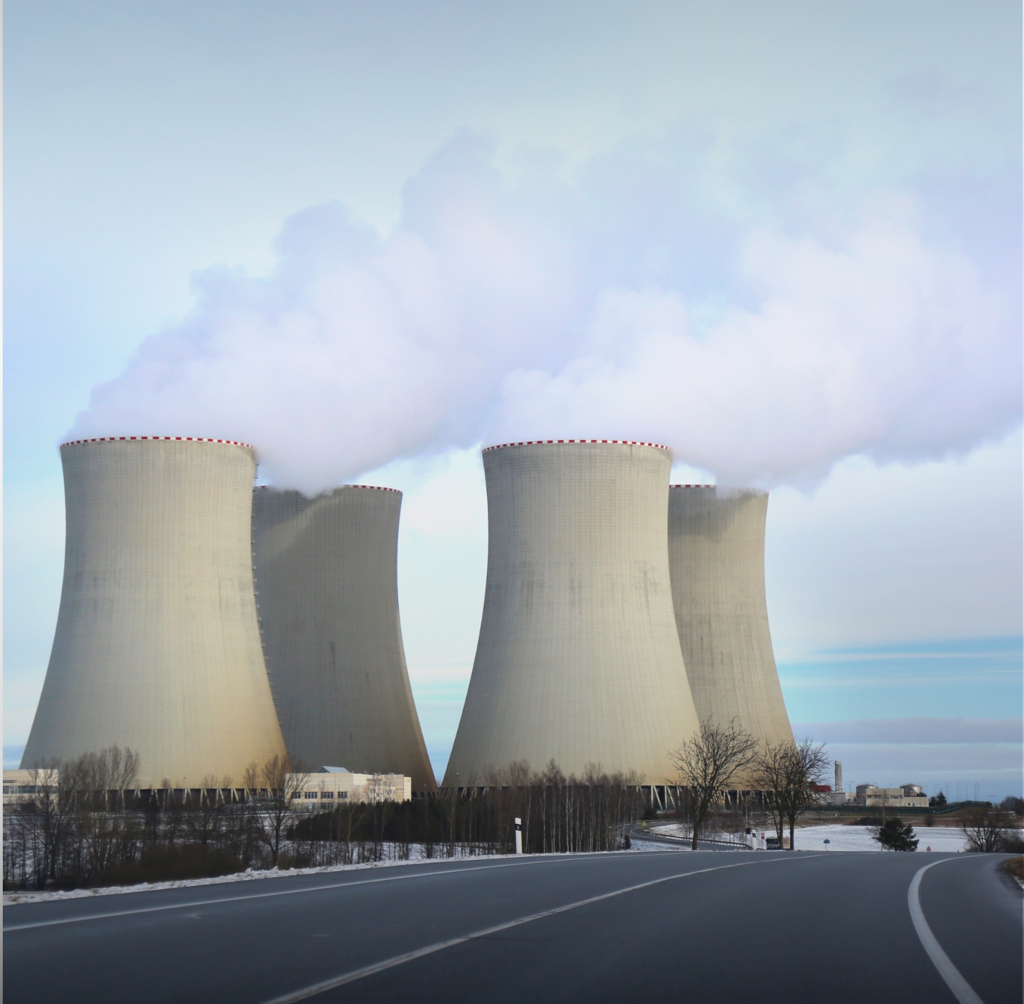 Image of four cooling towers of a power plant.